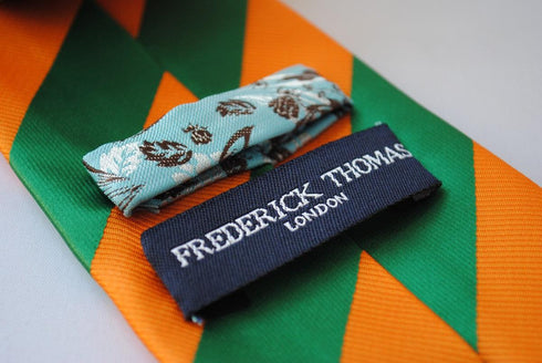 green and orange barber striped design tie